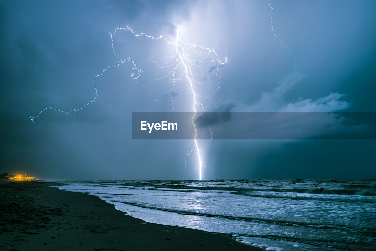 Bright lightning bolt strikes in the north sea during a summer thunderstorm