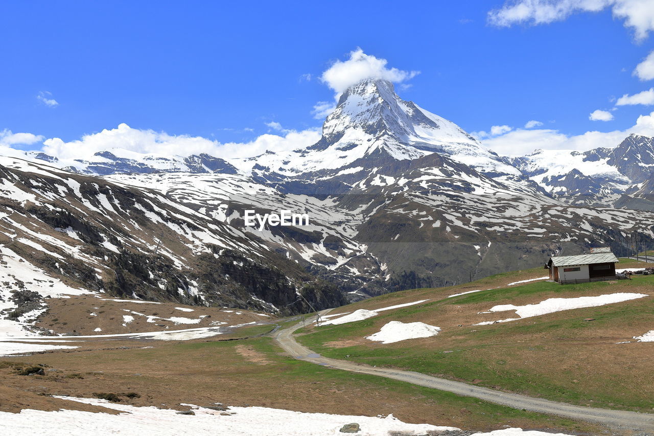 Scenic view of snowcapped mountains against sky