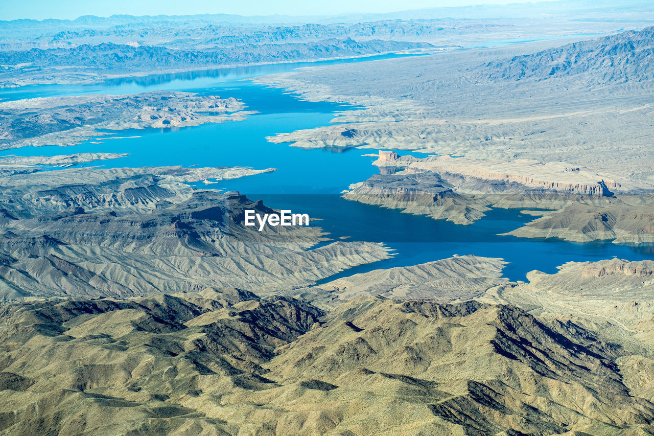 HIGH ANGLE VIEW OF LAKE AND SNOWCAPPED MOUNTAINS