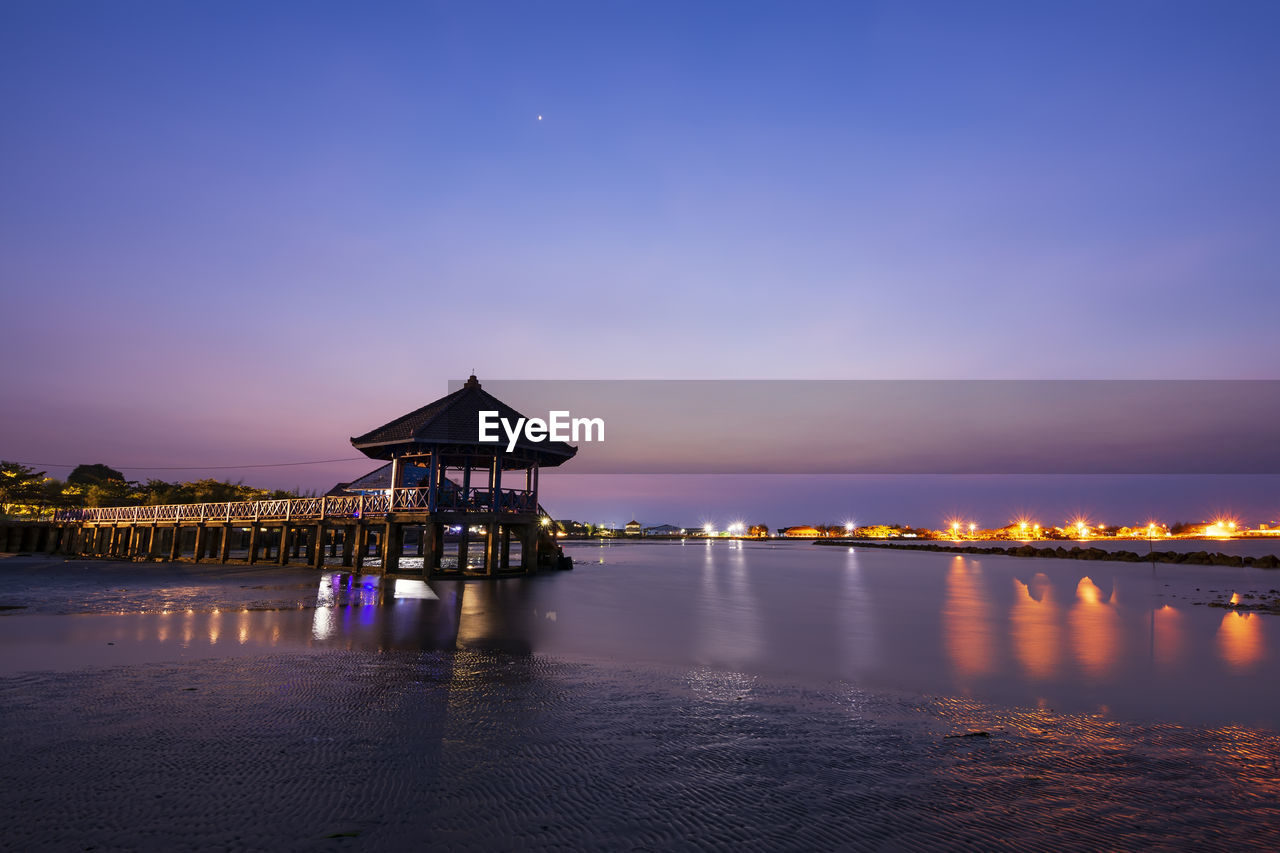 Scenic view of sea against sky at night