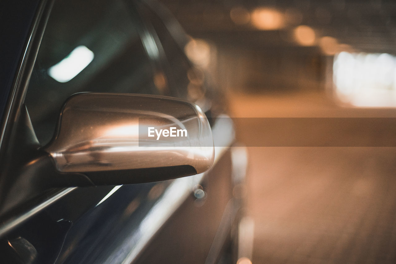 Close-up of car on road at night