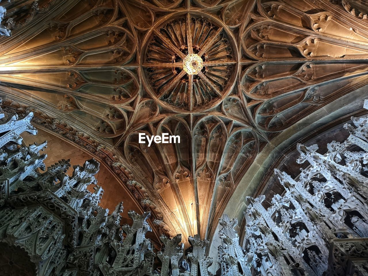 ceiling, architecture, built structure, low angle view, dome, lighting equipment, place of worship, indoors, religion, no people, building, belief, illuminated, spirituality, pattern, travel destinations, worship, chandelier, vault, catholicism, arch, decoration, architectural feature, the past, history, ornate, architecture and art, travel, lighting
