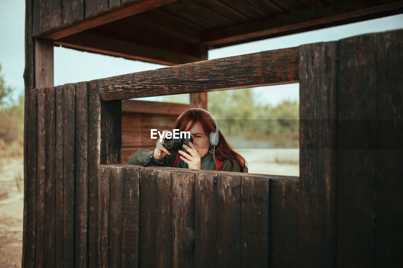 Portrait of woman on wooden structure