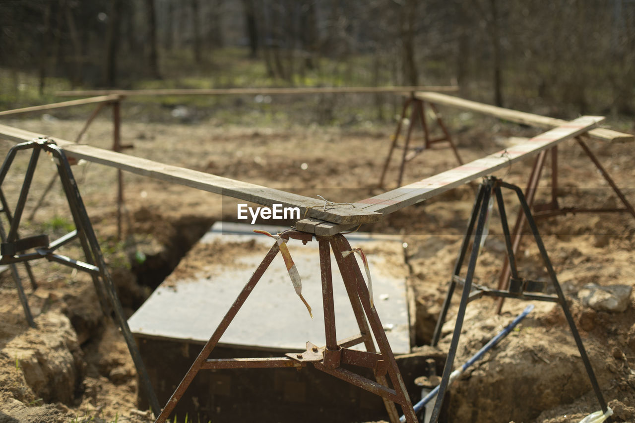 high angle view of metallic structure against trees