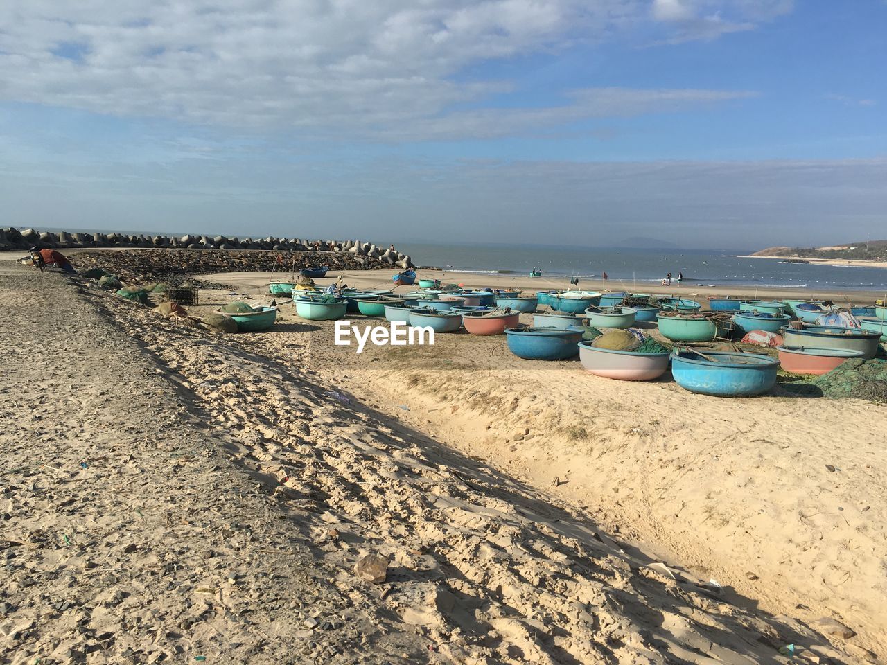 BOATS ON BEACH AGAINST SKY