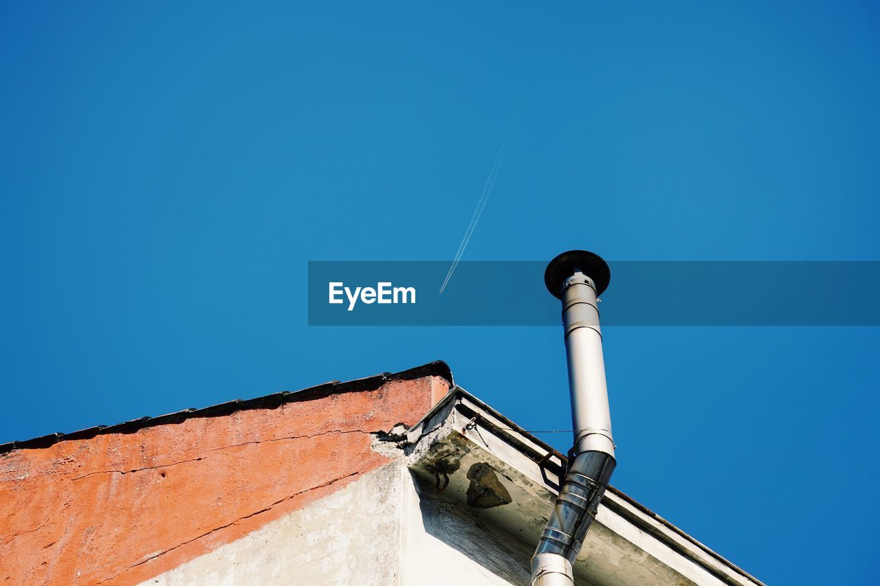 Chimney on the rooftop of the house in the city