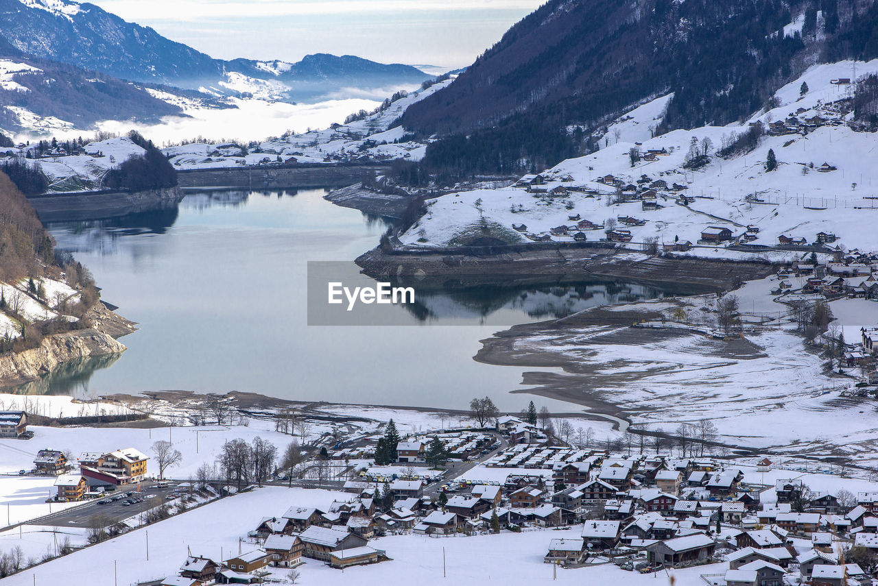 SCENIC VIEW OF LAKE BY SNOWCAPPED MOUNTAIN