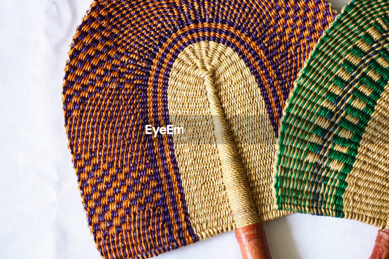 Close-up of colorful hand fans