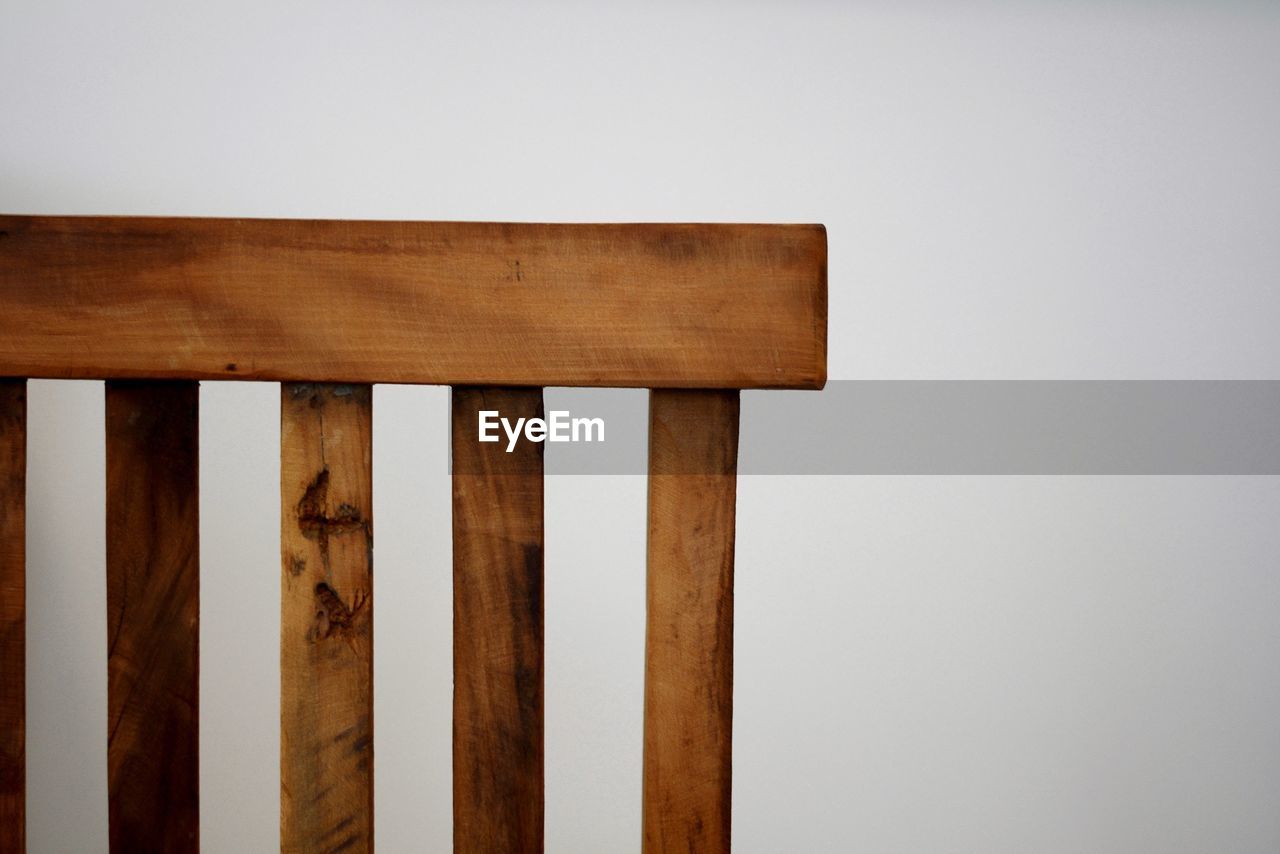 Close-up of wooden fence against white background