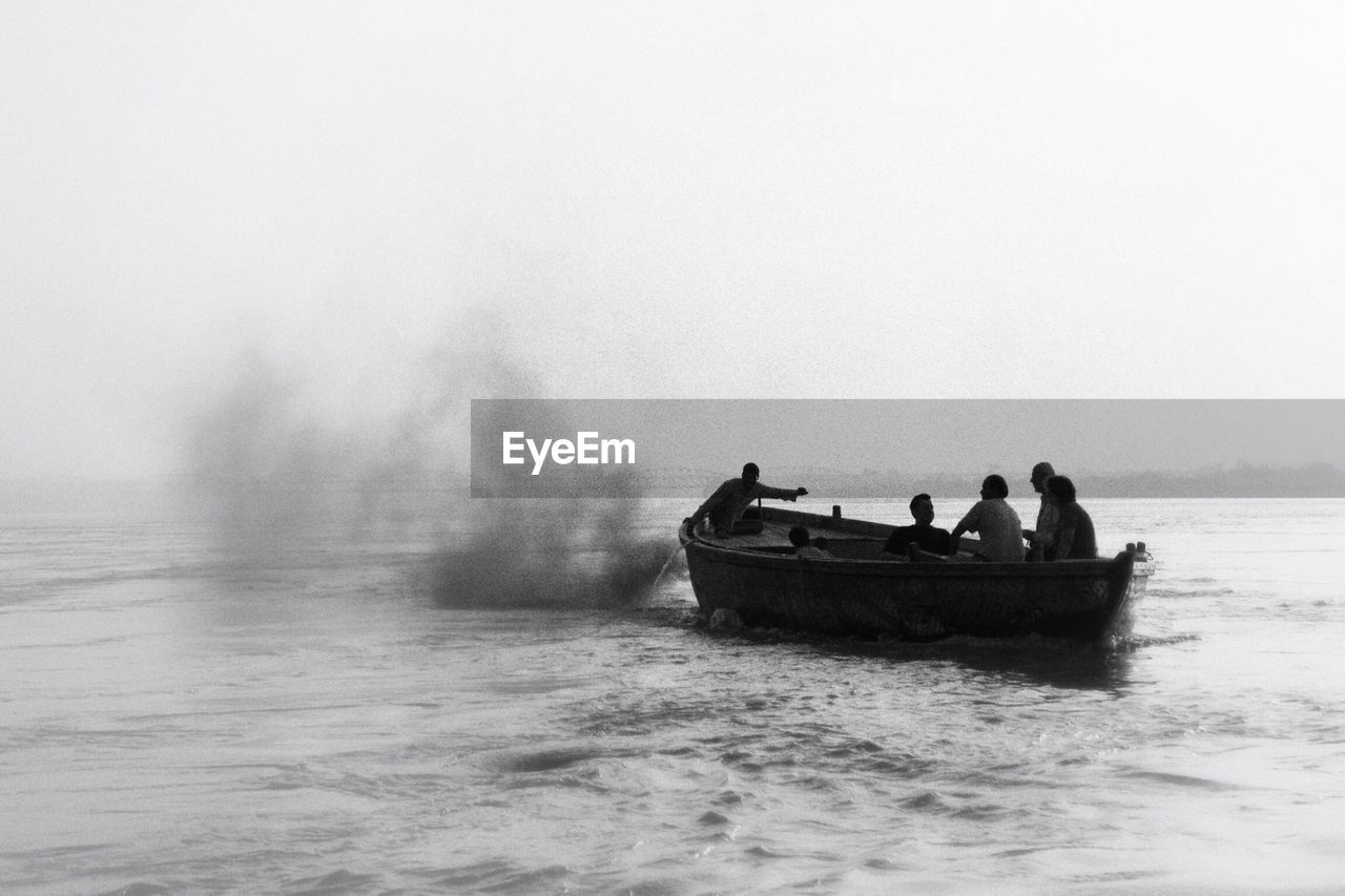 Men in a boat on lake