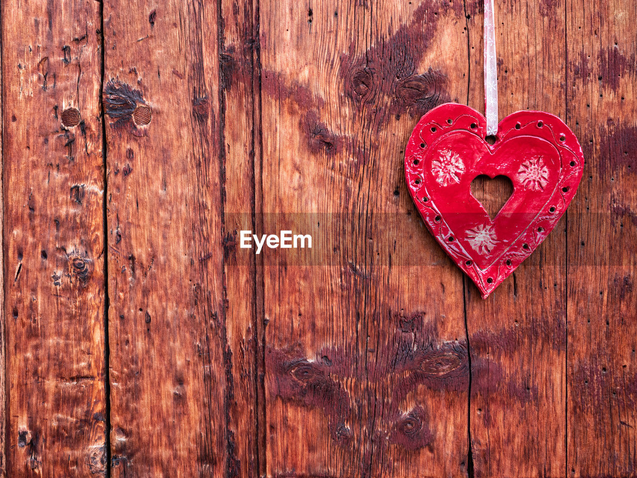 directly above shot of heart shape on wooden wall