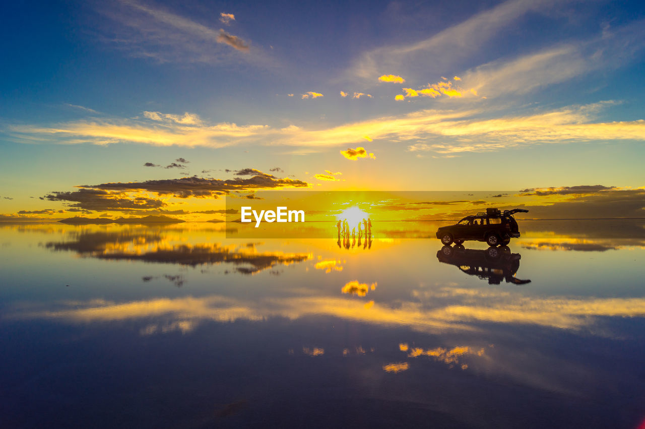 Scenic view of lake against sky during sunset