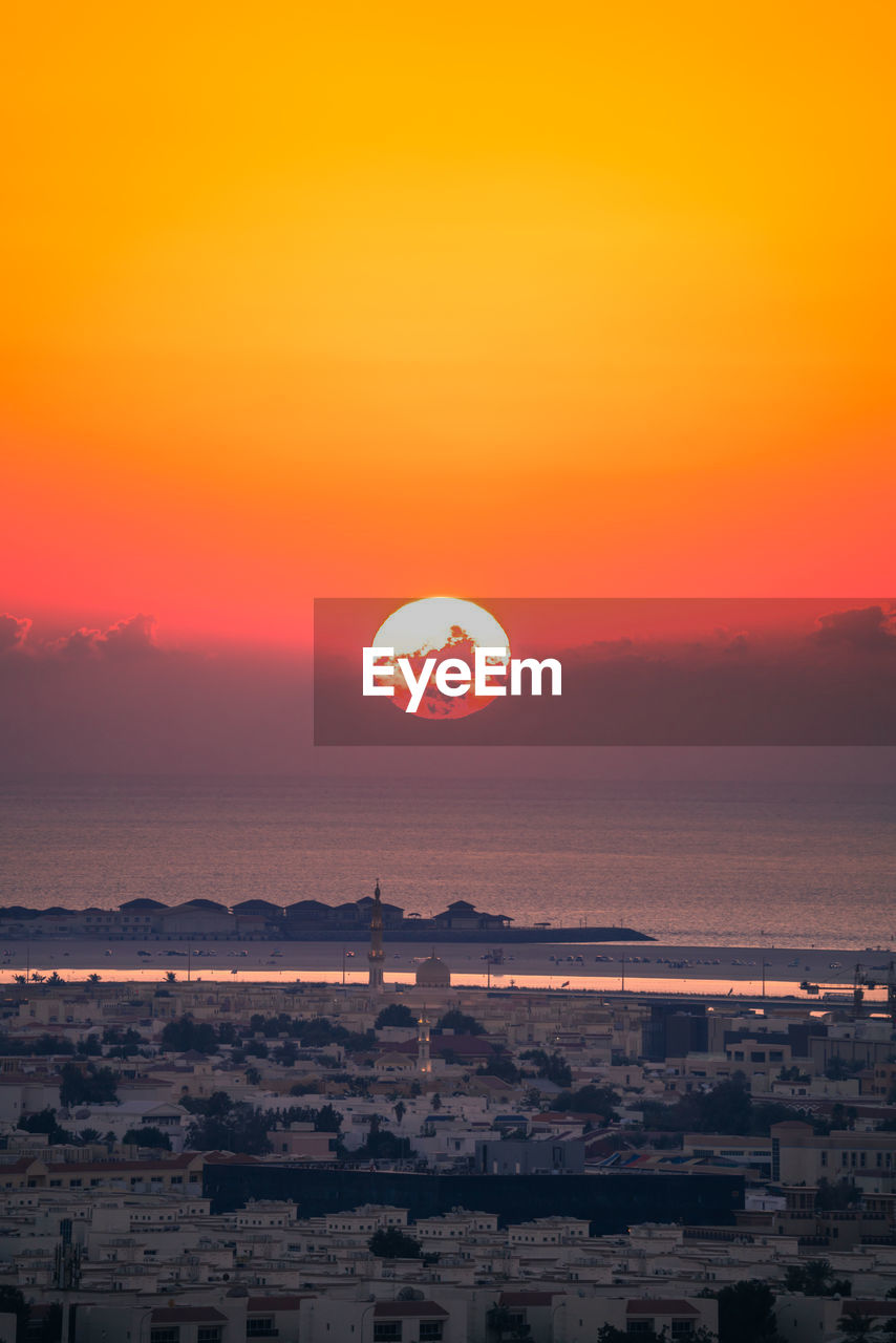 Scenic view of sea against romantic sky at sunset