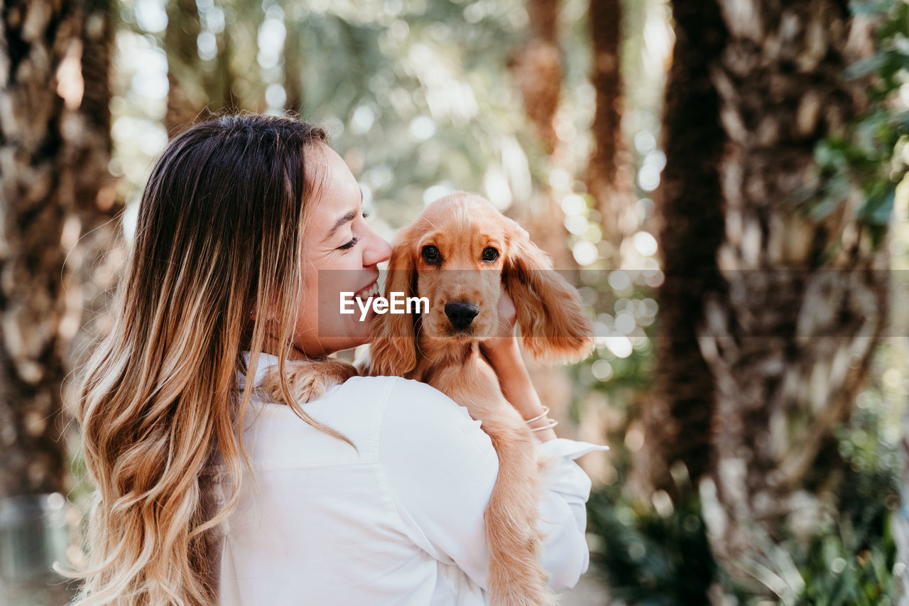 Woman with dog at park