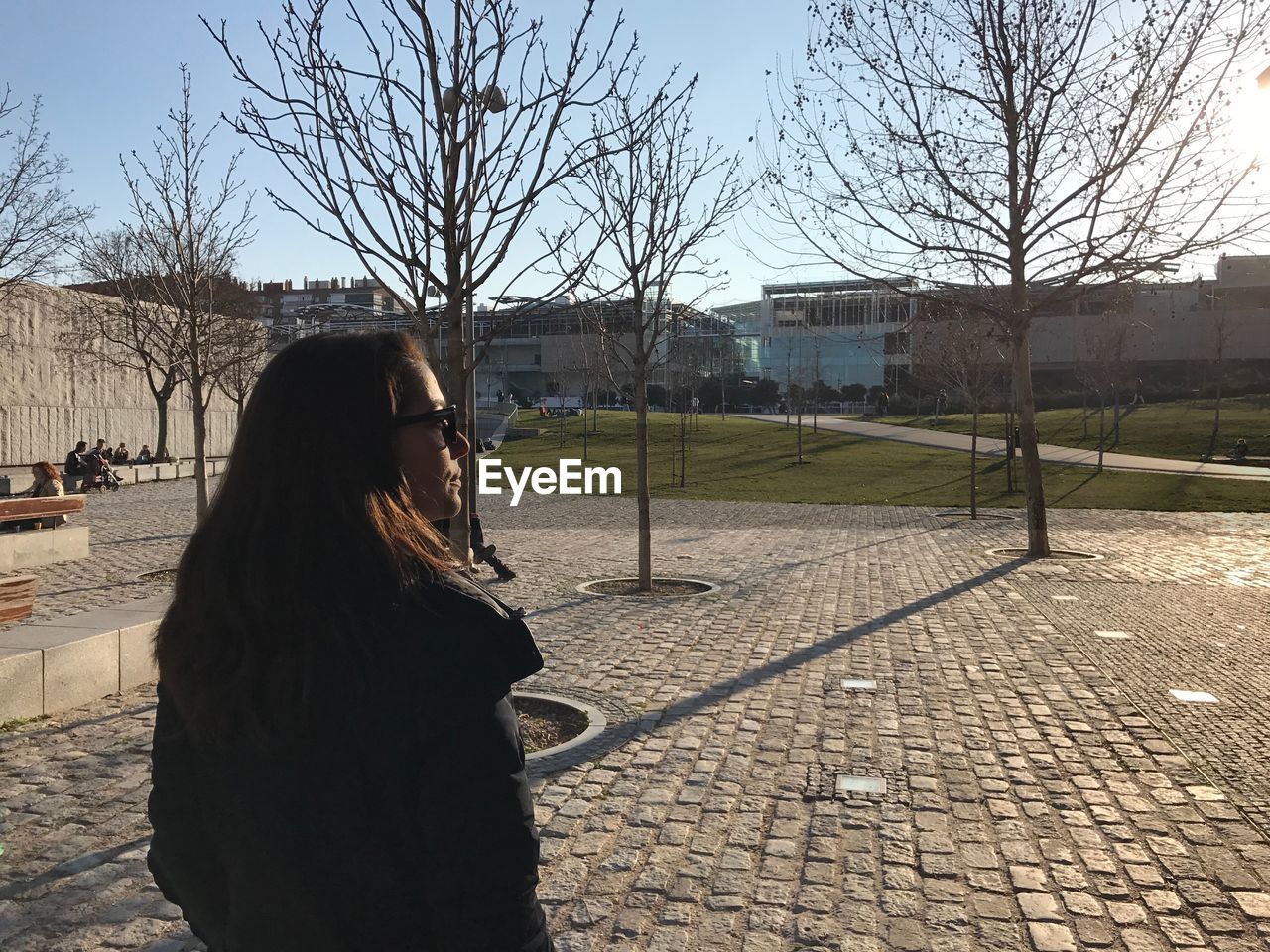 WOMAN LOOKING AT VIEW OF TREE