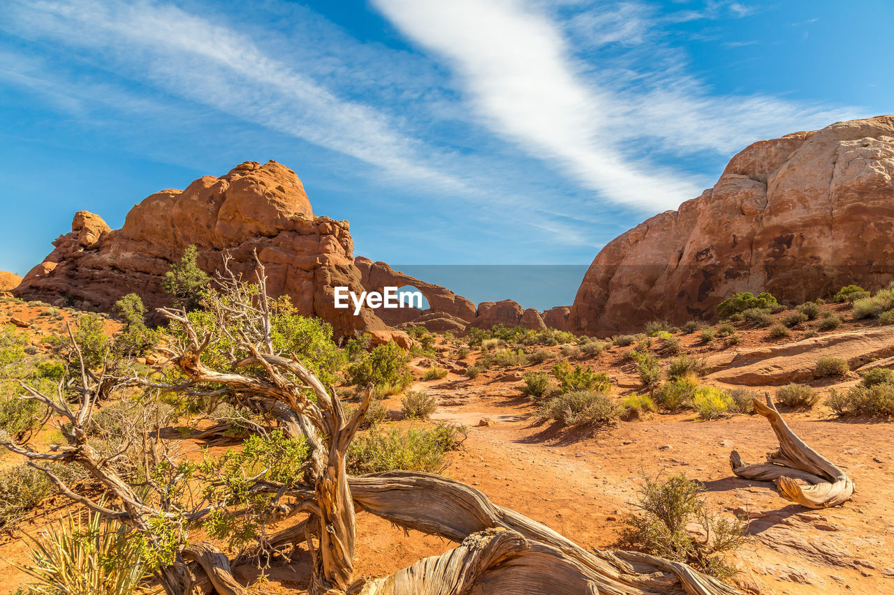 Rock formation on landscape against sky