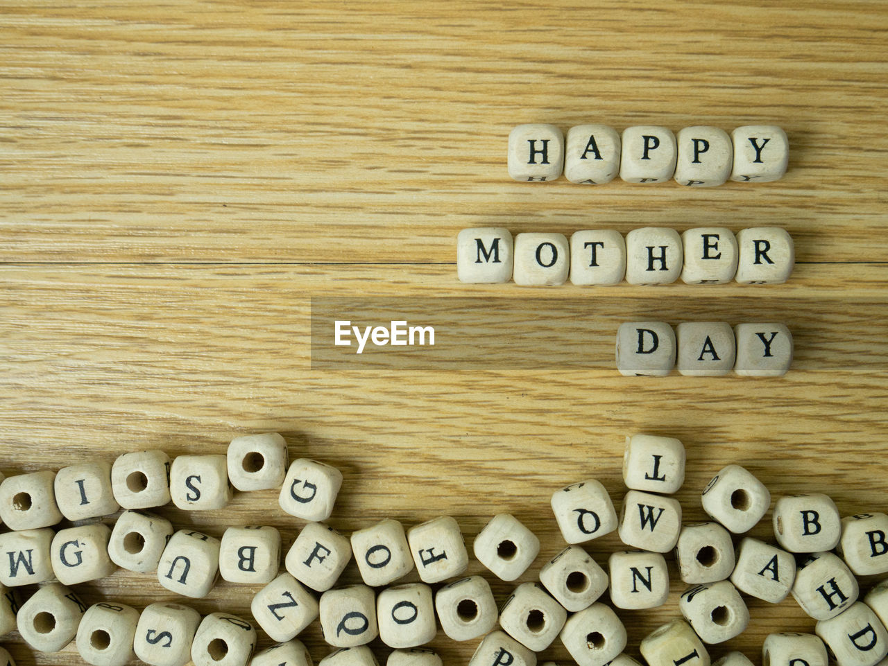 CLOSE-UP OF TEXT ON WOODEN TABLE