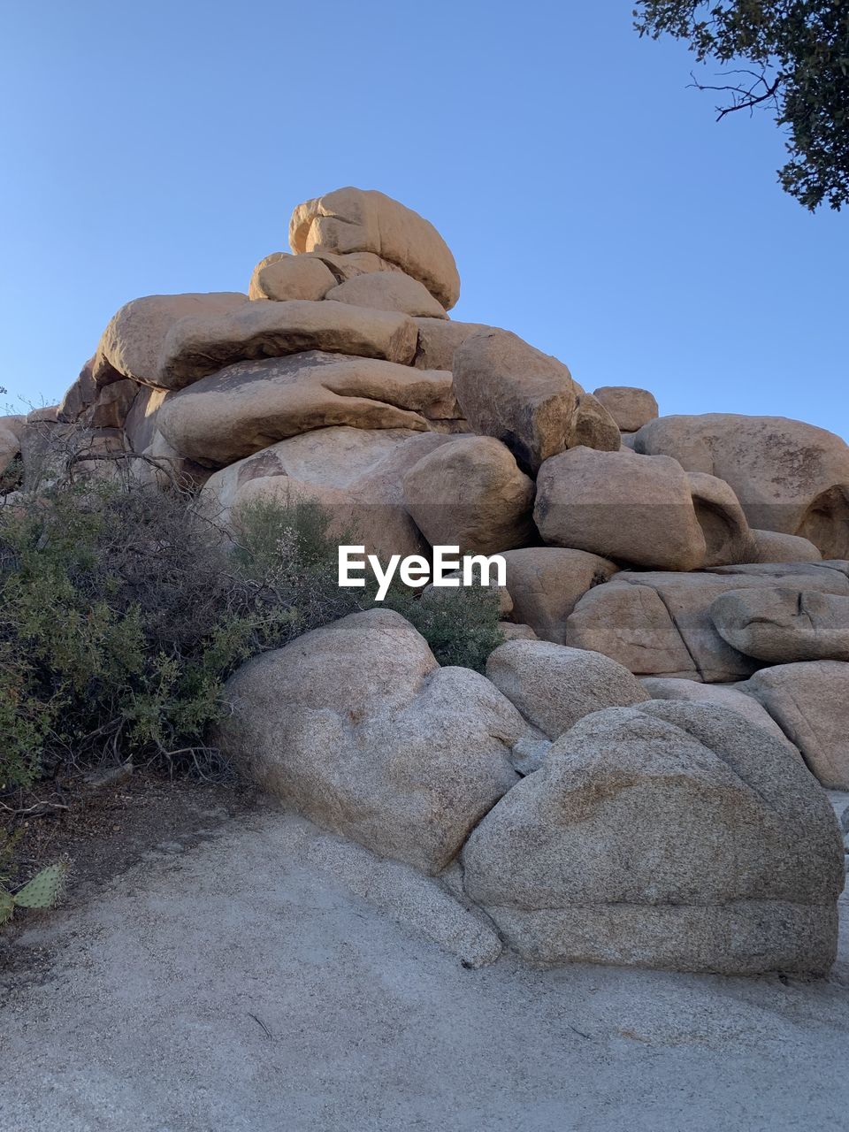 Low angle view of statue against rock formation