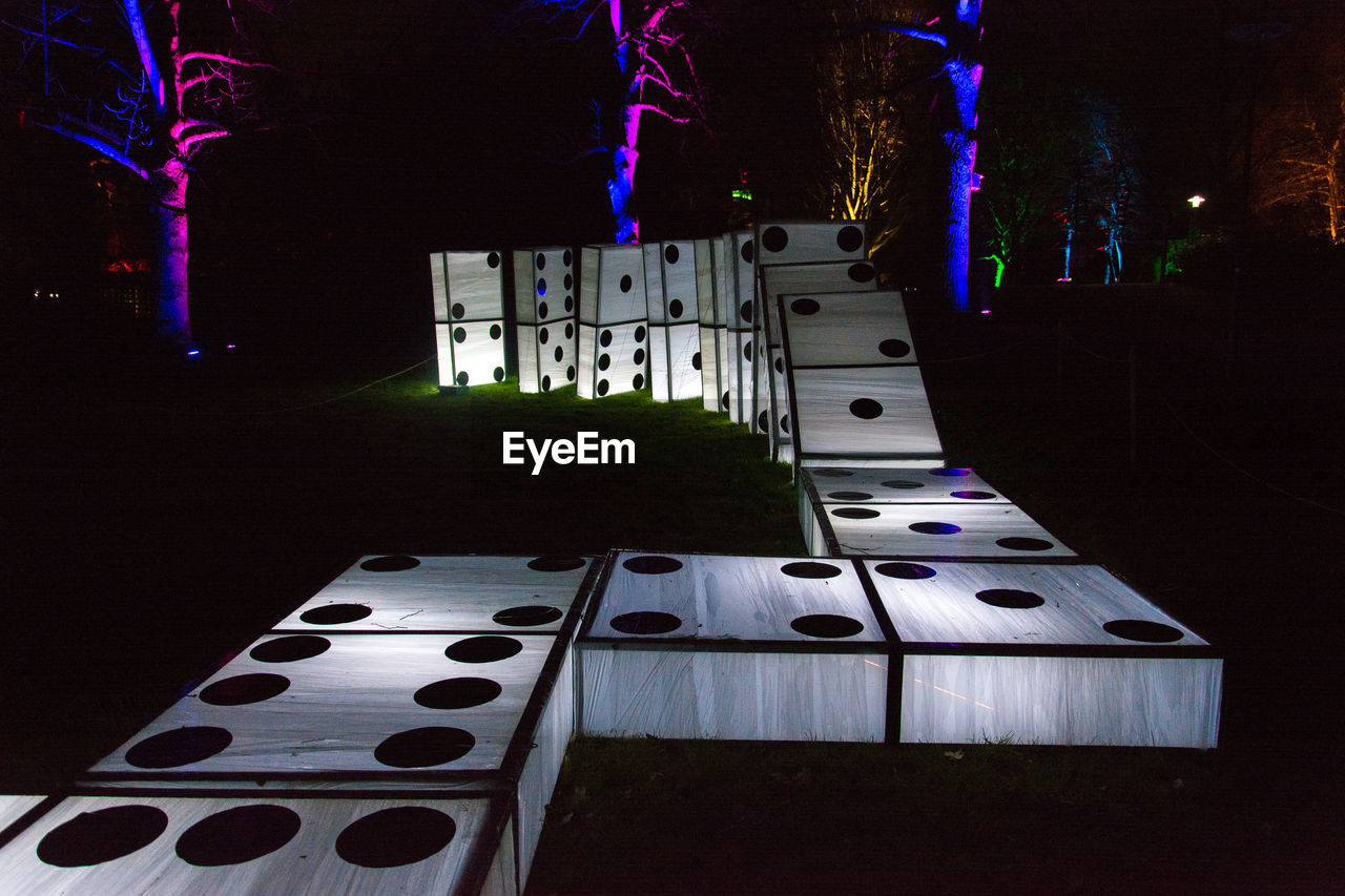 LOW ANGLE VIEW OF ILLUMINATED BUILDINGS