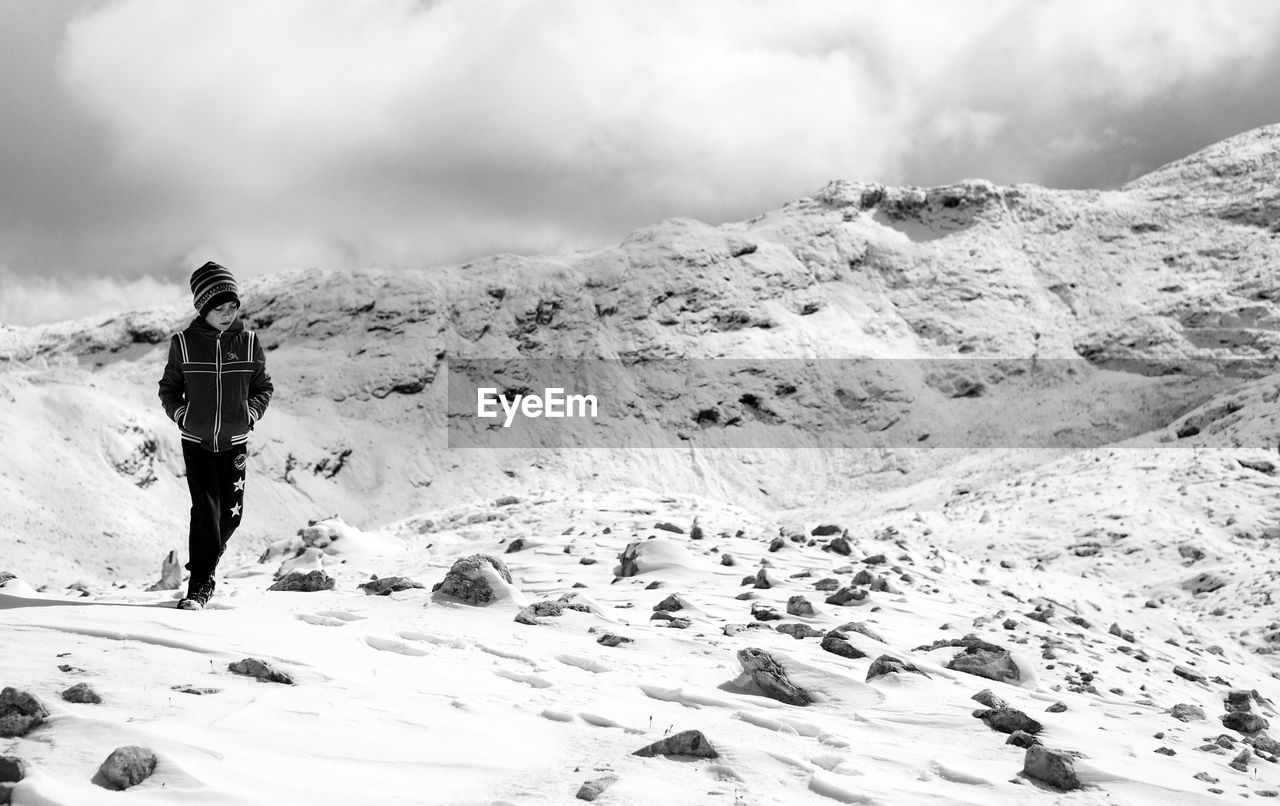 First snow on dolomites, walking on altopiano della rosetta