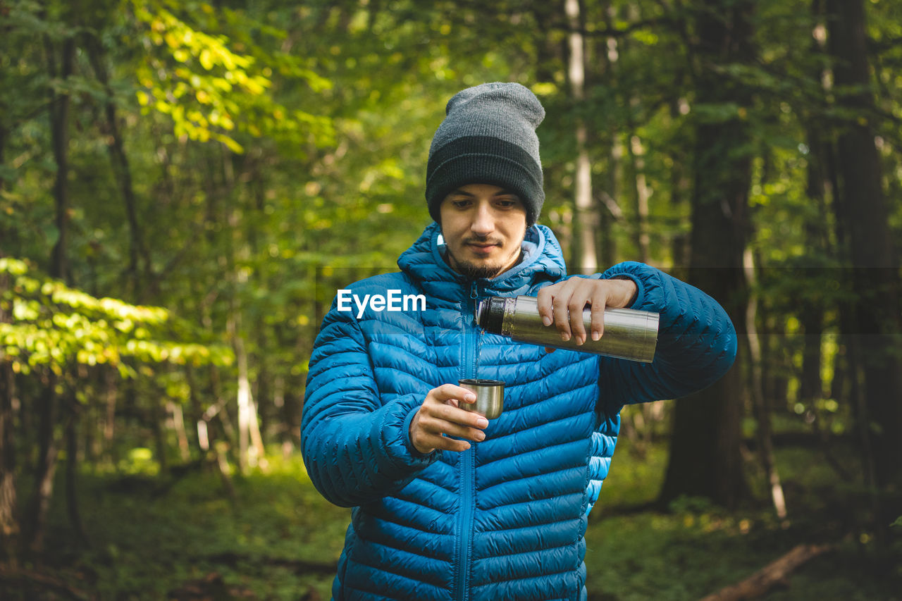 portrait of young man standing outdoors