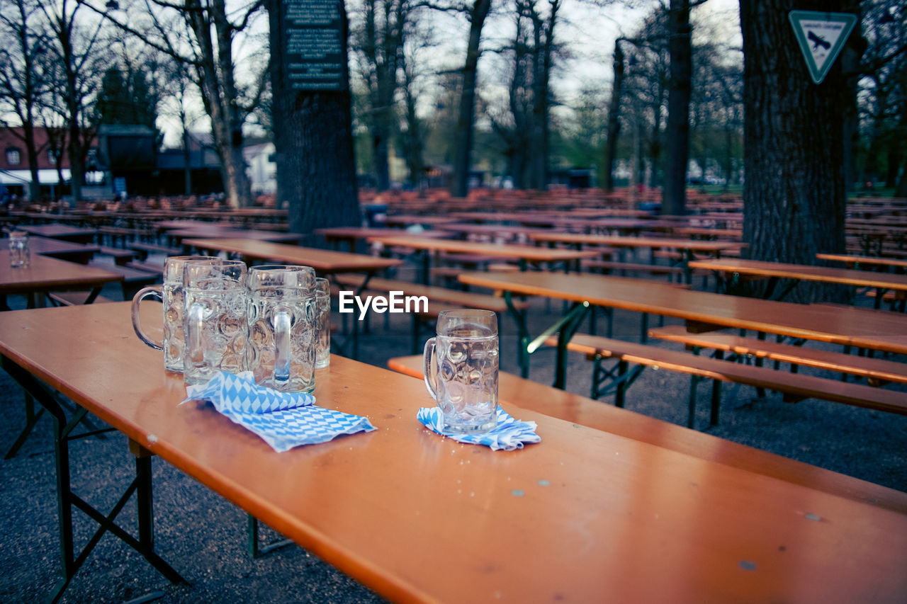 Empty beer glasses on table