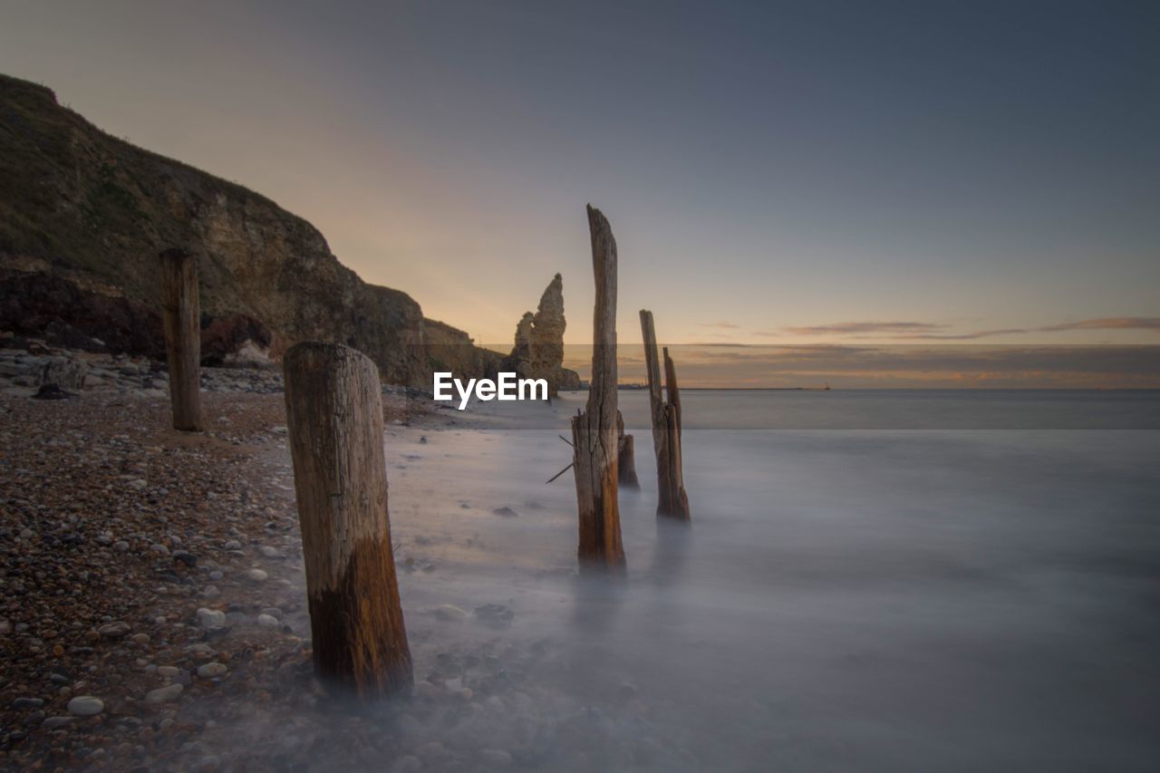 View of beach at sunset