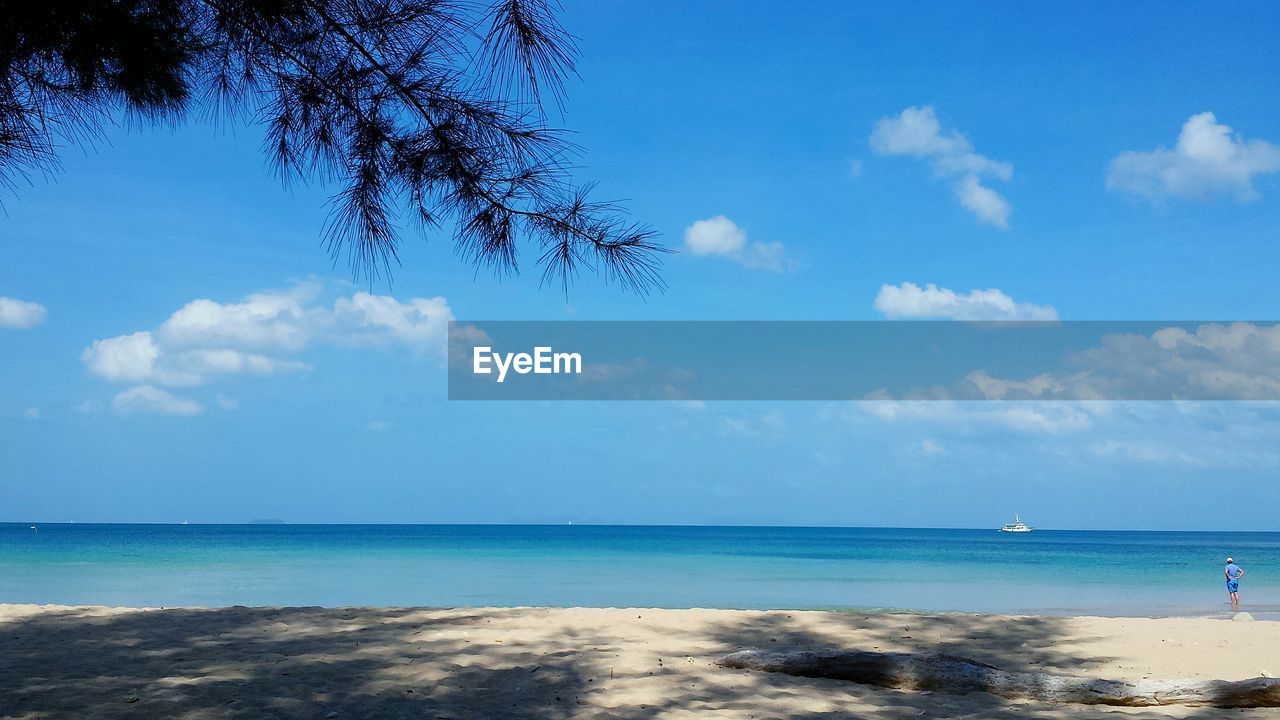 Beach with cloudy sky in background