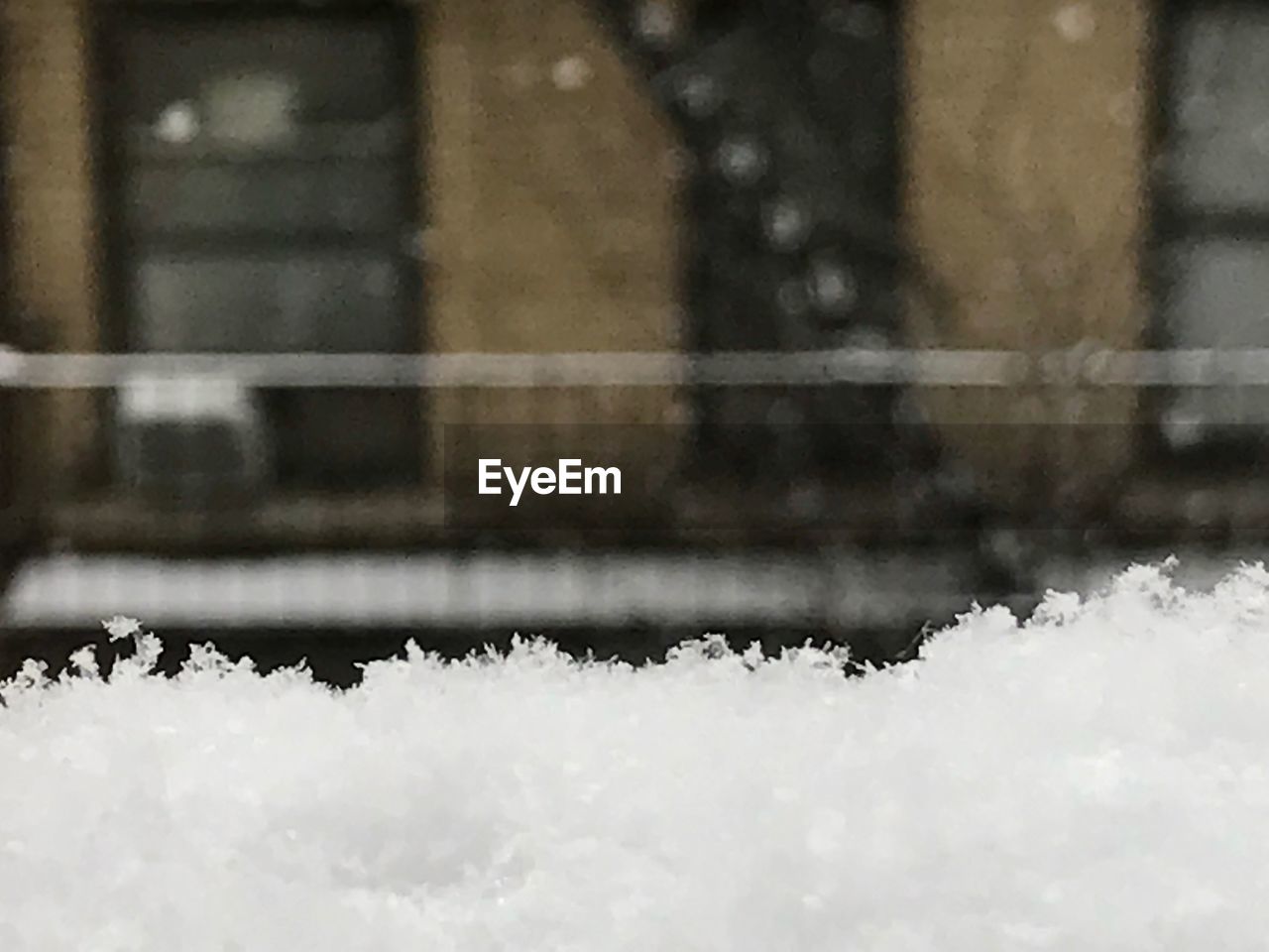 CLOSE-UP OF SNOW ON WOOD