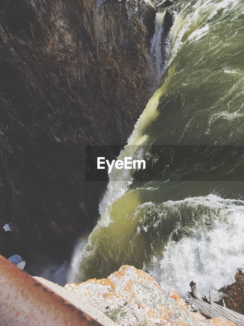 Scenic view of waterfall against sky