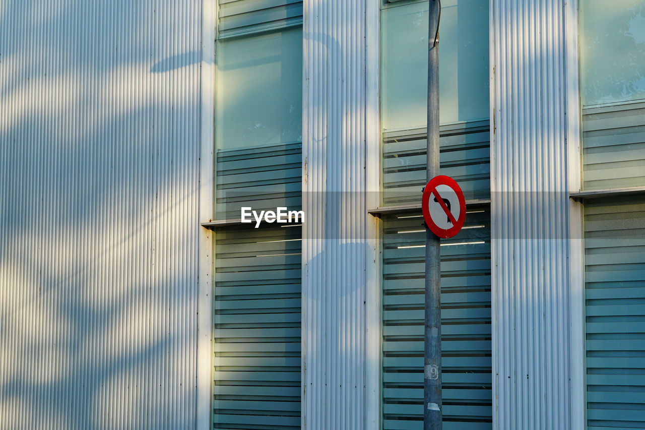Text on closed shutter of building