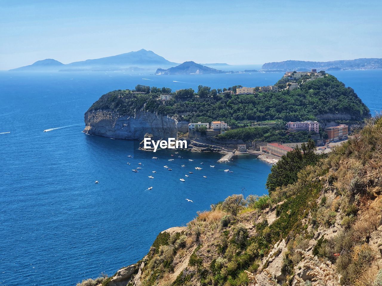 HIGH ANGLE VIEW OF BAY AGAINST CLEAR SKY