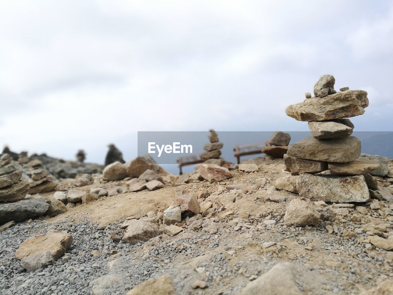 CLOSE-UP OF STACK OF ROCKS ON SHORE