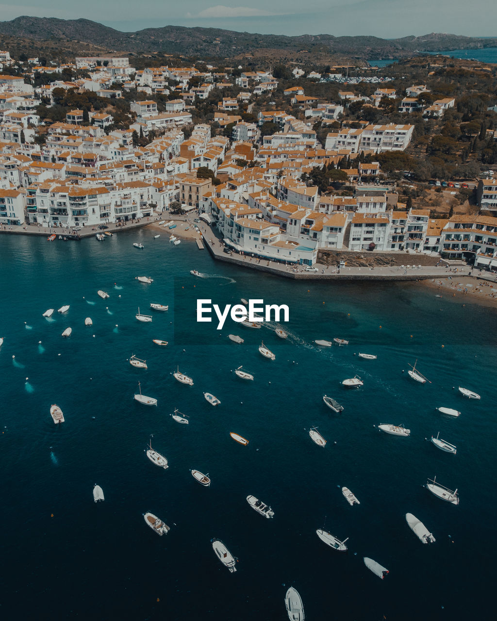 High angle view of townscape by sea