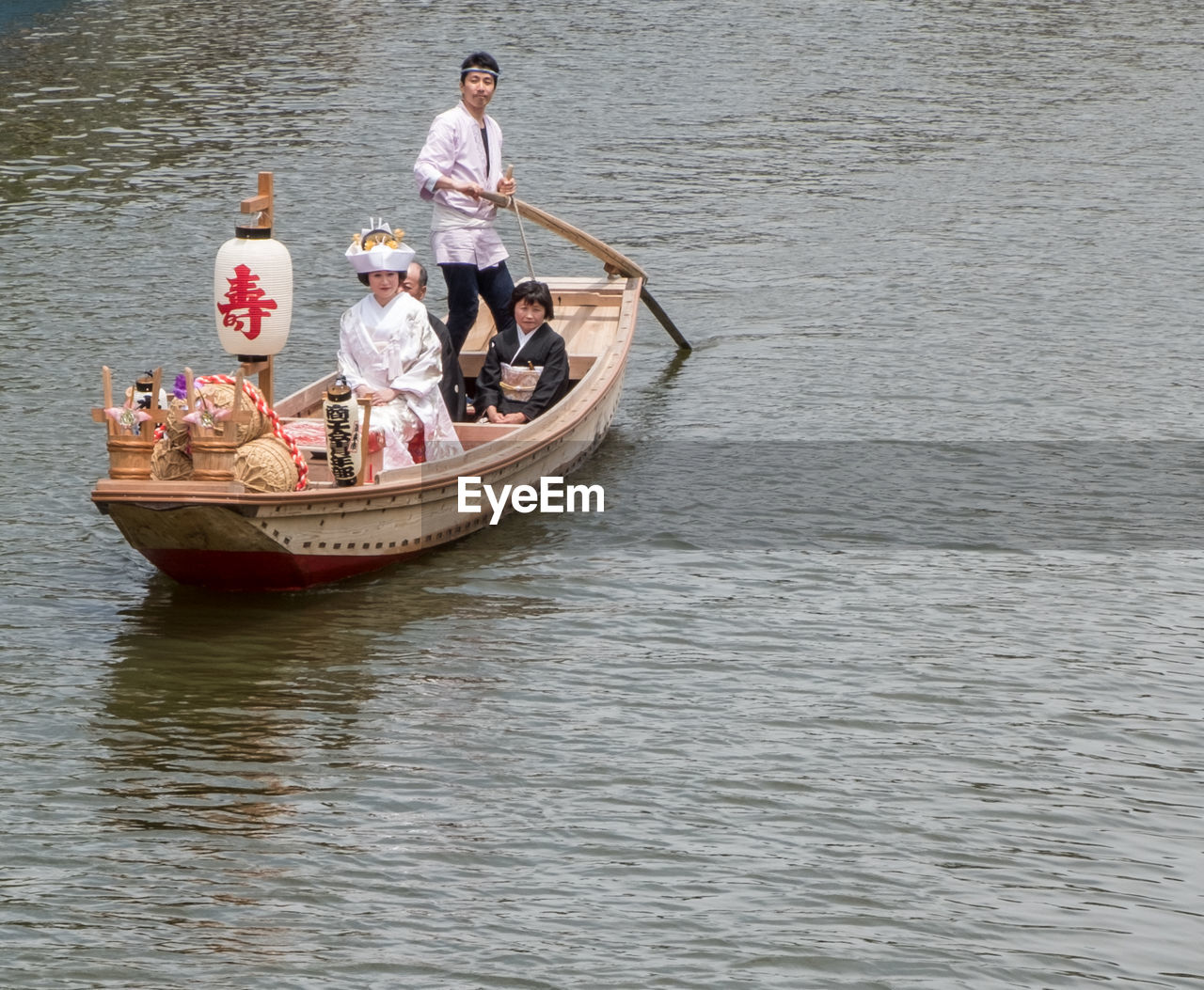 HIGH ANGLE VIEW OF PEOPLE ON BOAT