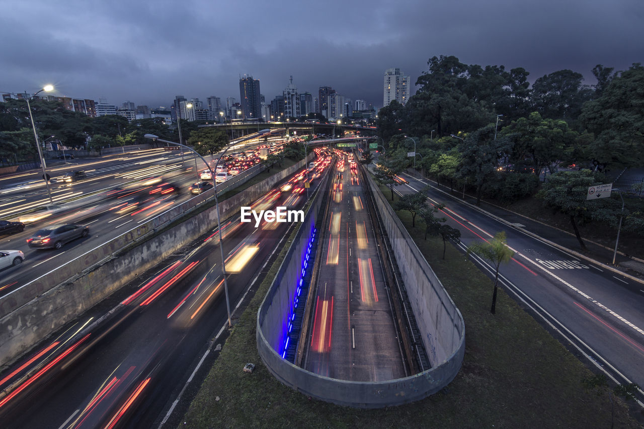 High angle view of light trails on road at night