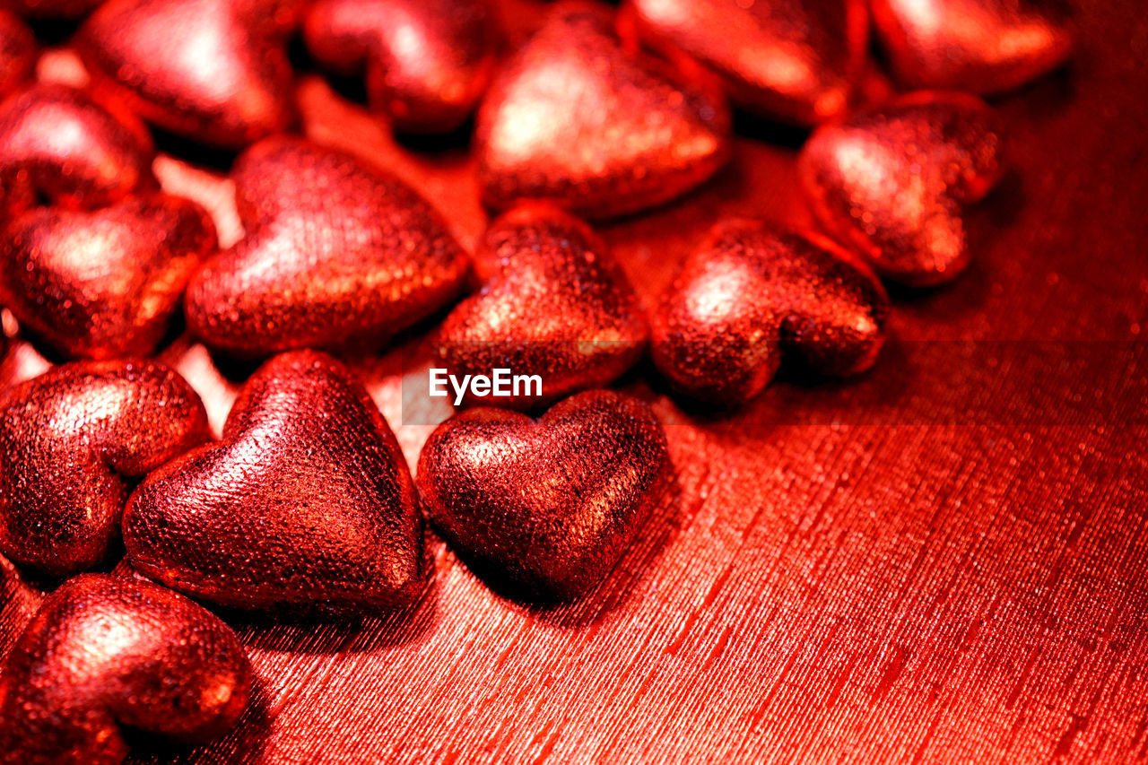 Close-up of red heart shape chocolates on table