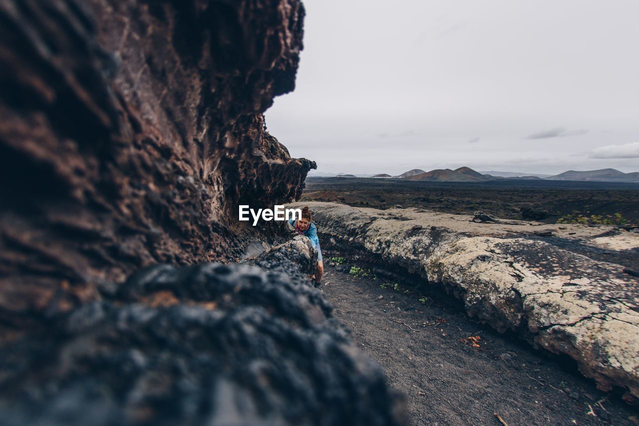 Scenic view of rocks on land against sky