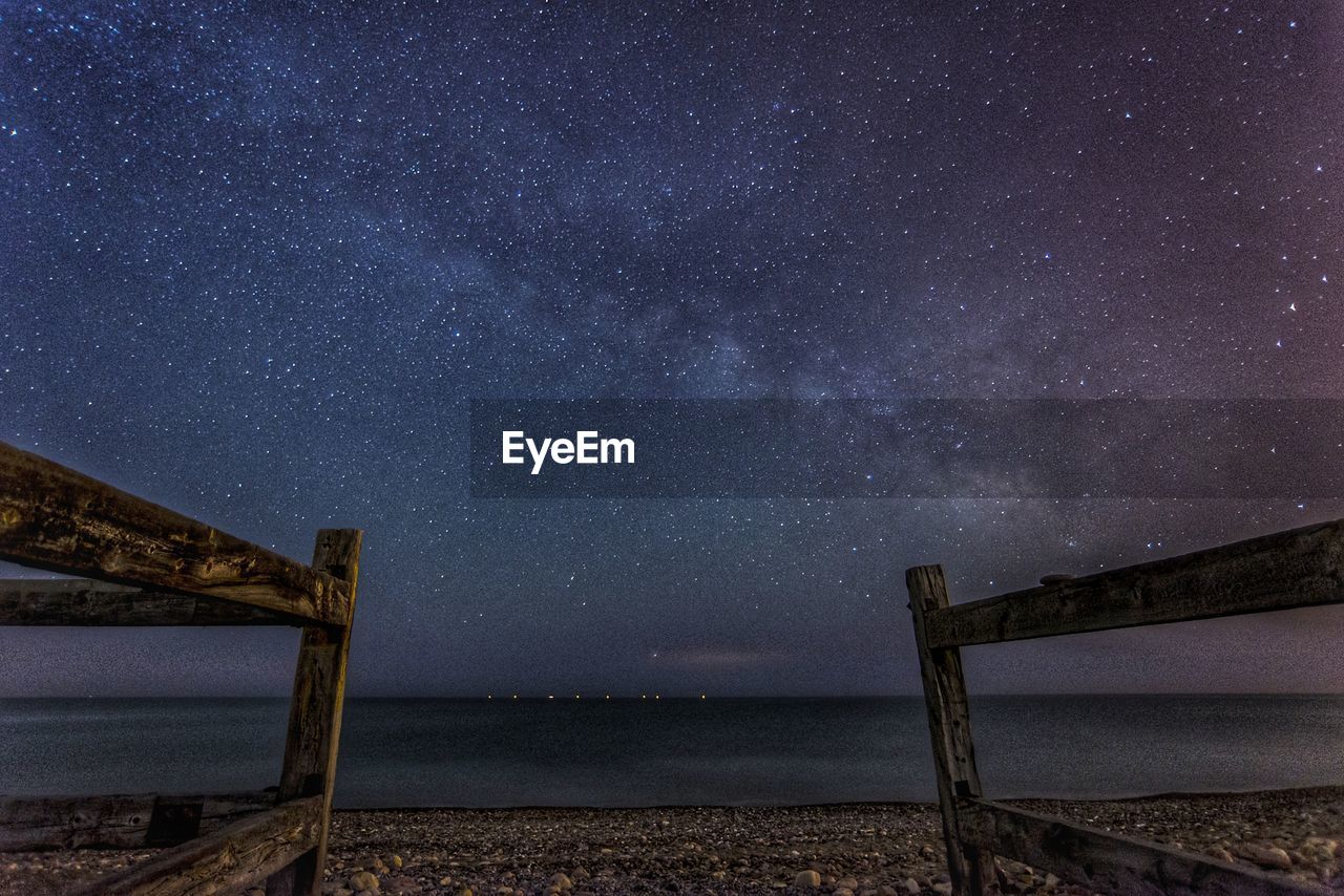 Scenic view of sea against sky at night