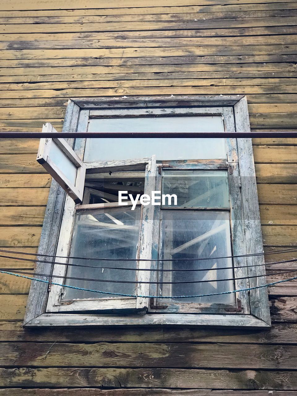 Low angle view of window in old building