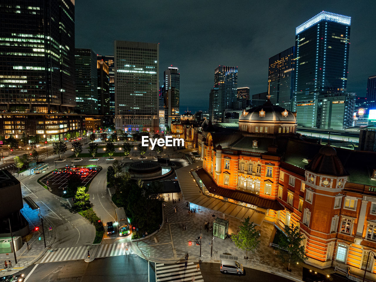 High angle view of illuminated city street and buildings and tokyo station at night