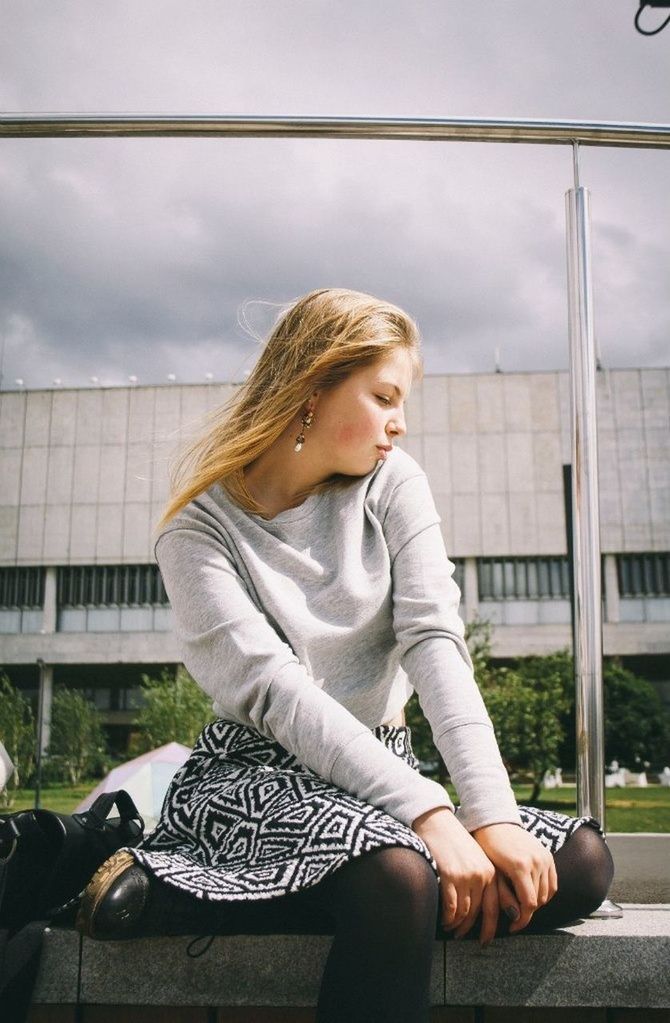 Beautiful serious young woman with eyes closed