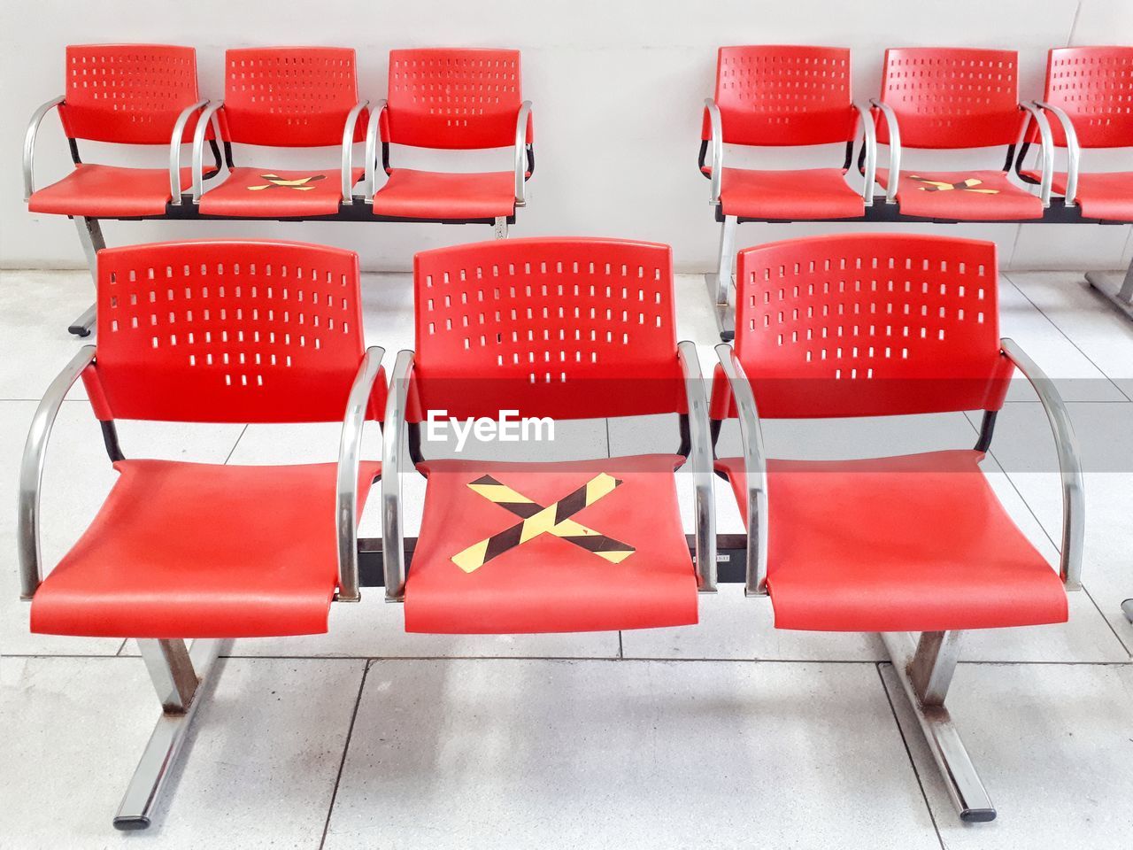 seat, chair, red, furniture, no people, indoors, empty, in a row, table, order, absence, group of objects