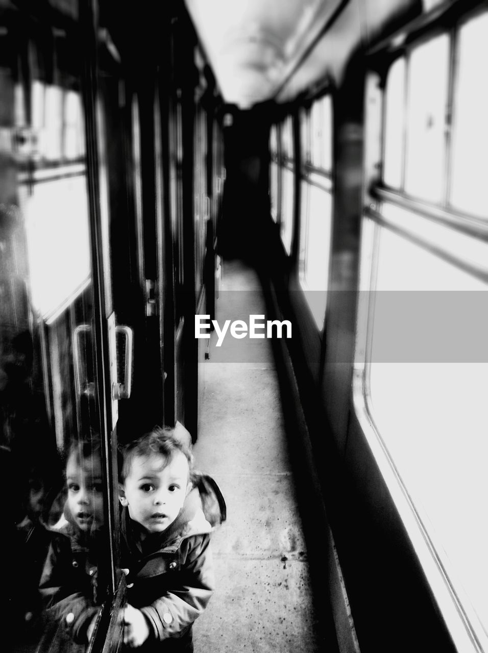 Boy standing in train