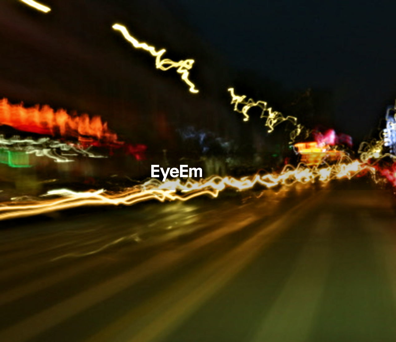 BLURRED MOTION OF LIGHT TRAILS ON ROAD