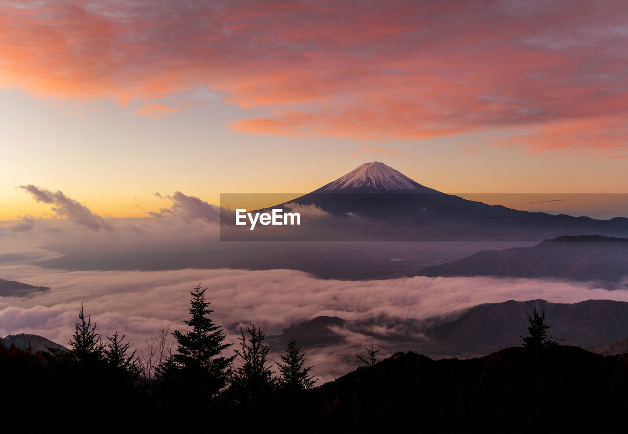 Scenic view of mountains against sky during sunset