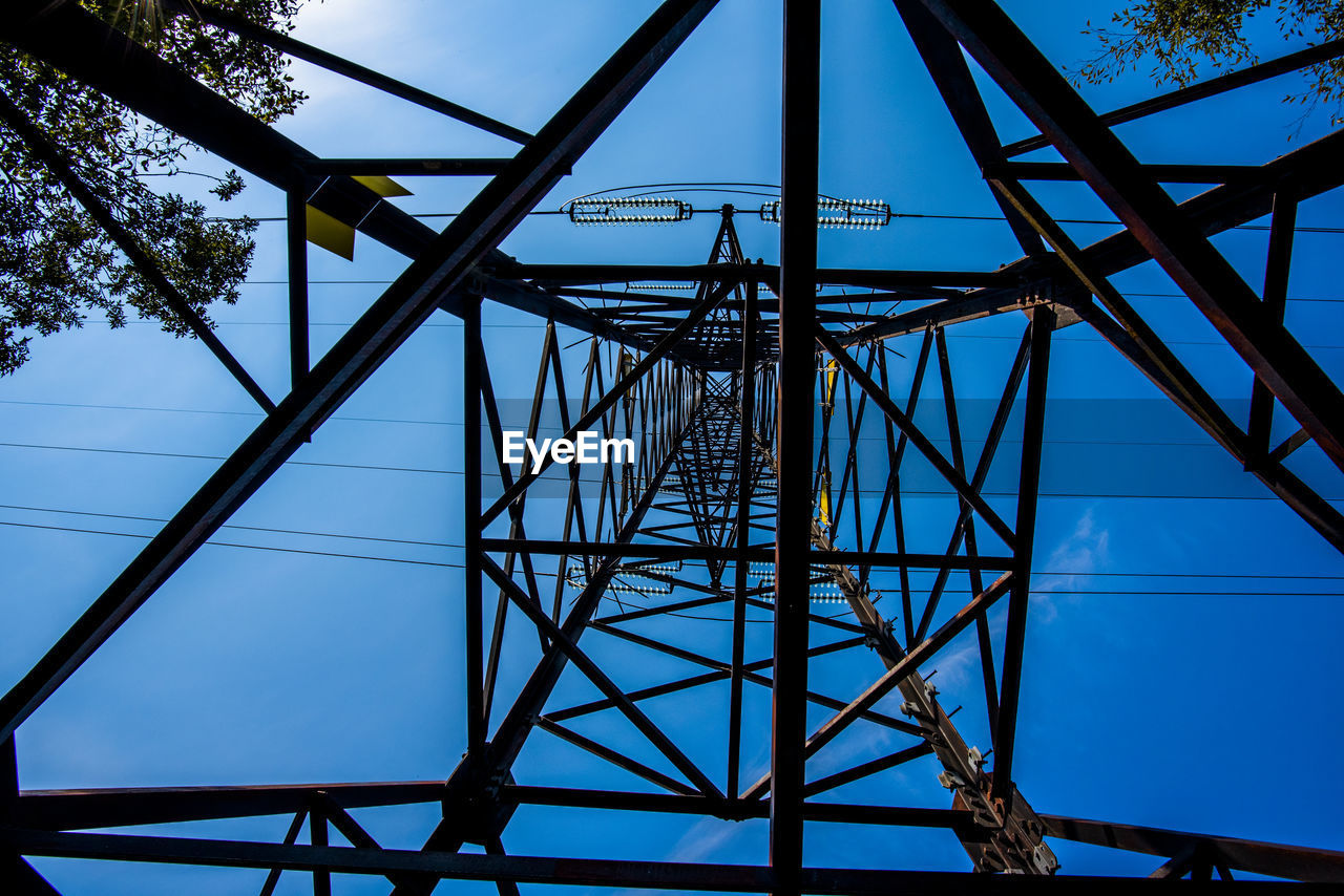 Steel beams make up the intricate geometries of a high voltage pylon