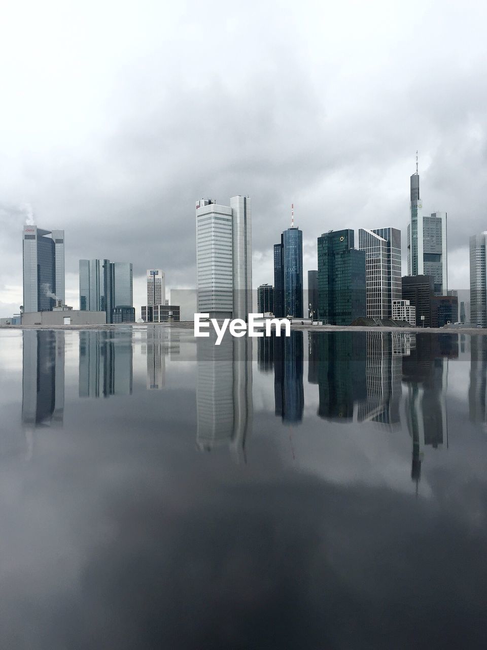 REFLECTION OF CITYSCAPE IN WATER