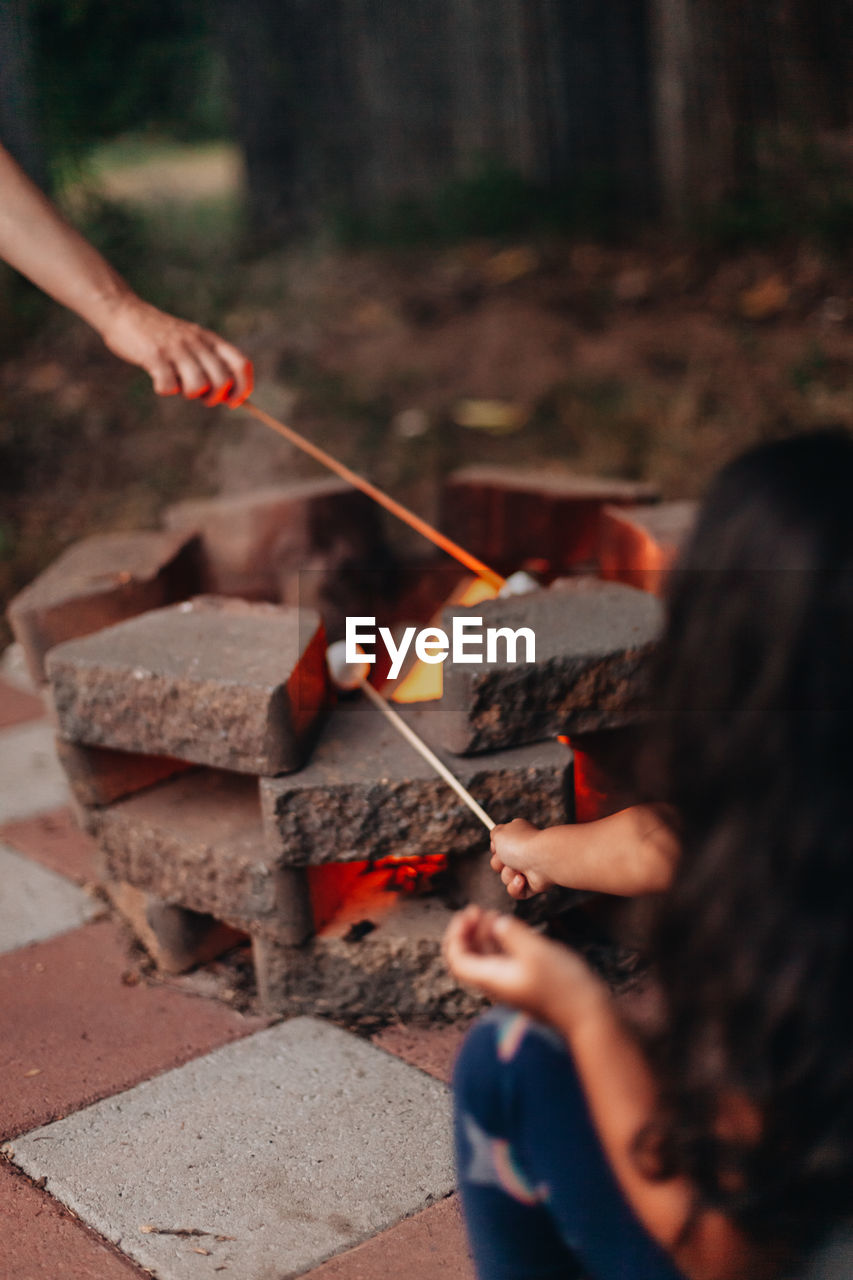 Making smores at home outdoors at the fire pit 