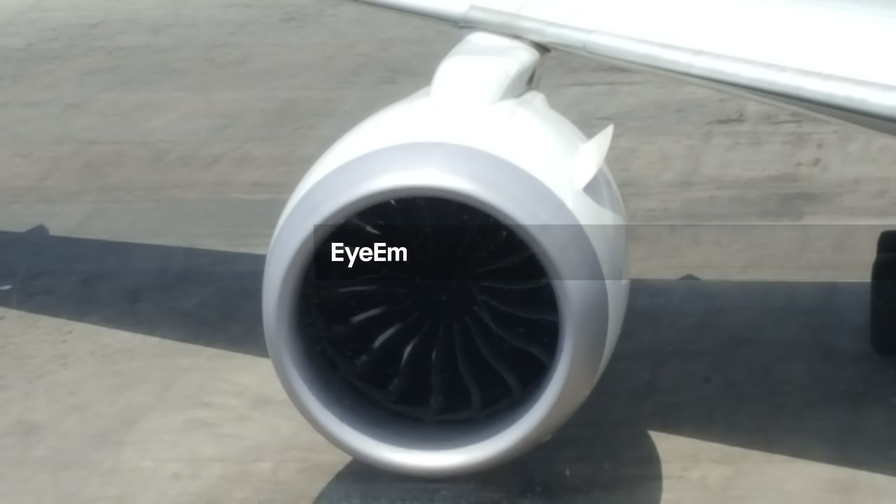HIGH ANGLE VIEW OF AIRPLANE IN AIRPORT